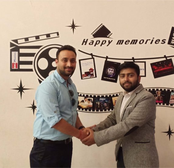 Amit Agrawal (L), Director of Khalti, and Bharat Agrawal, CEO of Cinestar Pvt. Ltd. (Big Movies) shake hands after signing partnership agreement