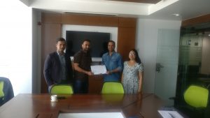 Amit Agrawal, Director of Khalti and Roshan Adiga, COO at Team Quest sign the agreement